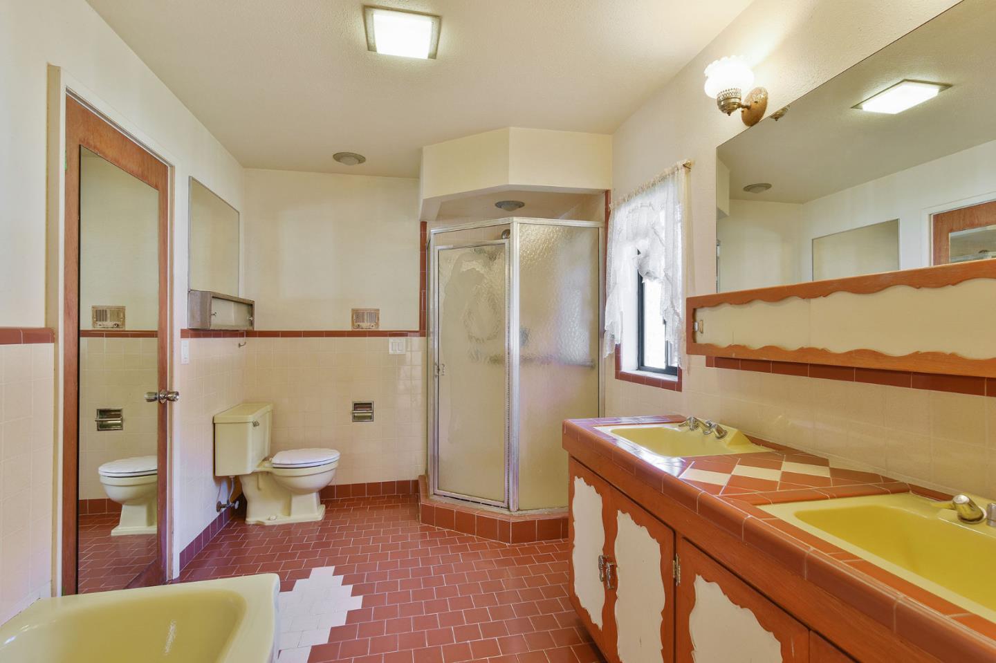 991 Zamora Drive Pacifica, CA 94044 - Photo 23 of 26 a bathroom with a sink a toilet and shower