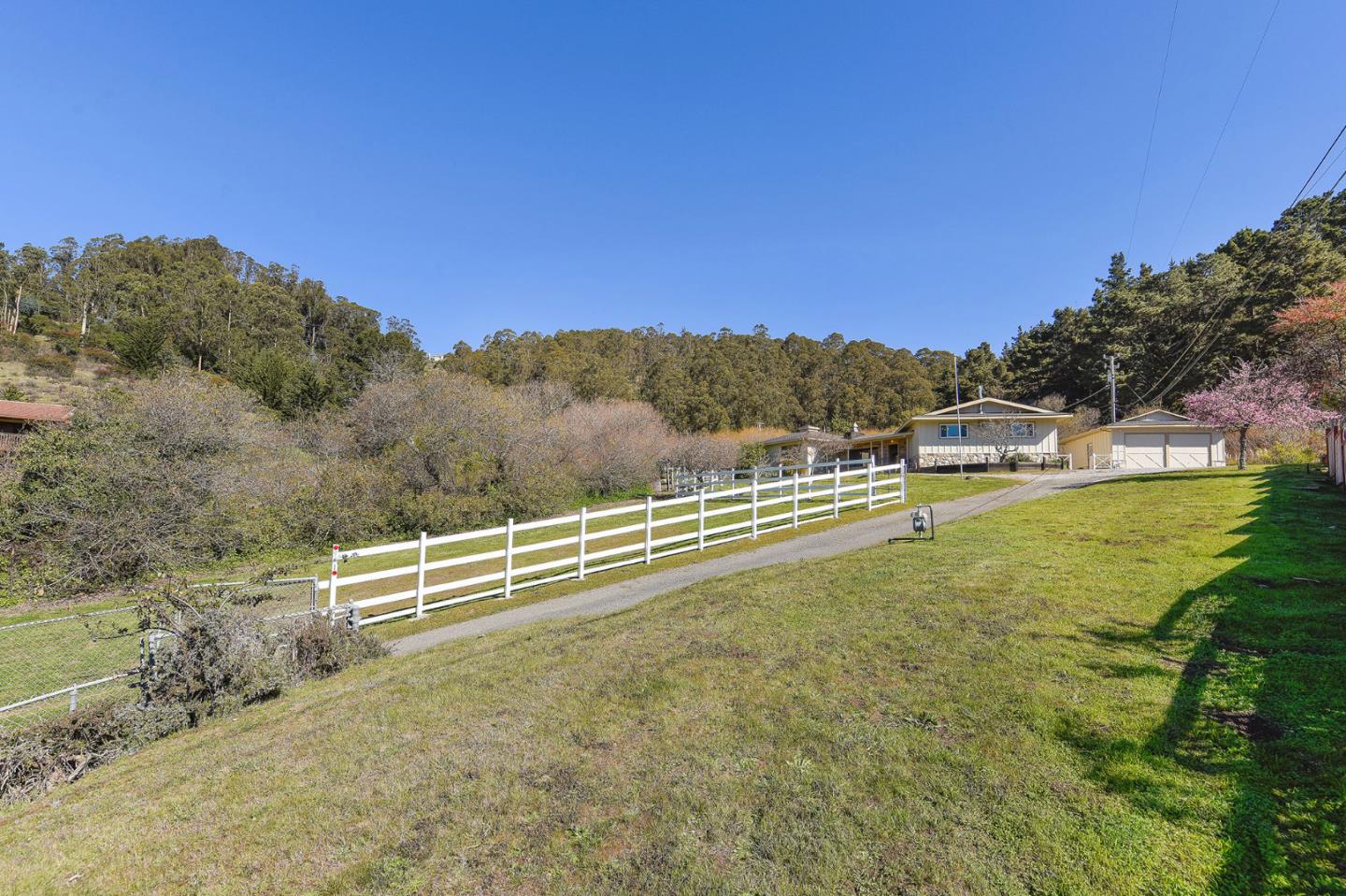 991 Zamora Drive Pacifica, CA 94044 - Photo 6 of 26 a view of a field with mountains in the background