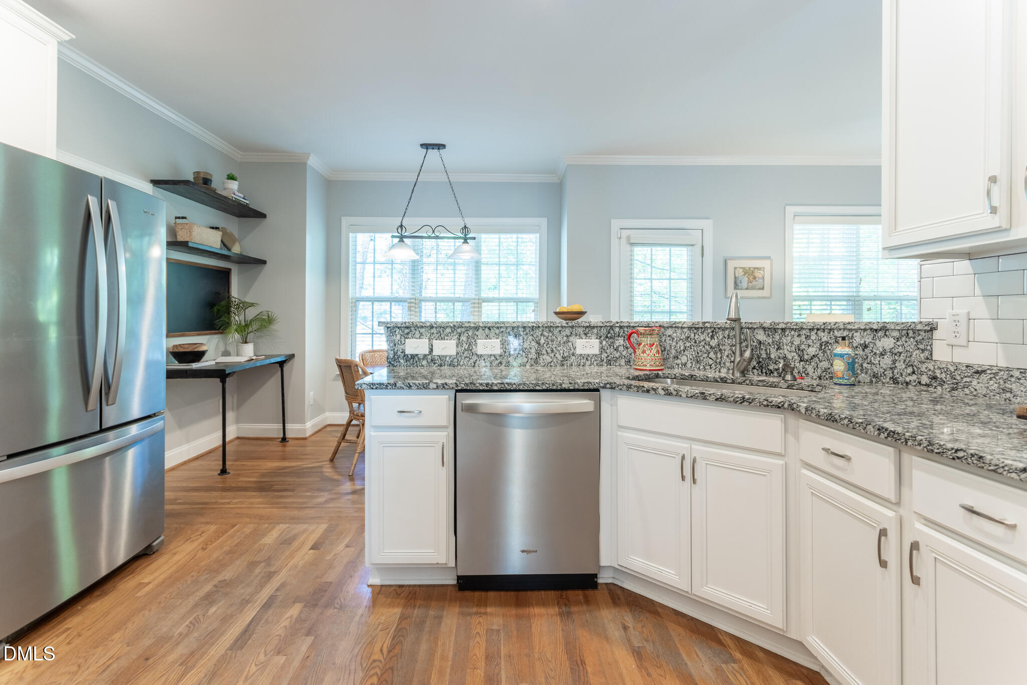 10 Highgrove Lane Durham, NC 27713 - Photo 10 of 41 a kitchen with kitchen island granite countertop a sink cabinets and stainless steel appliances