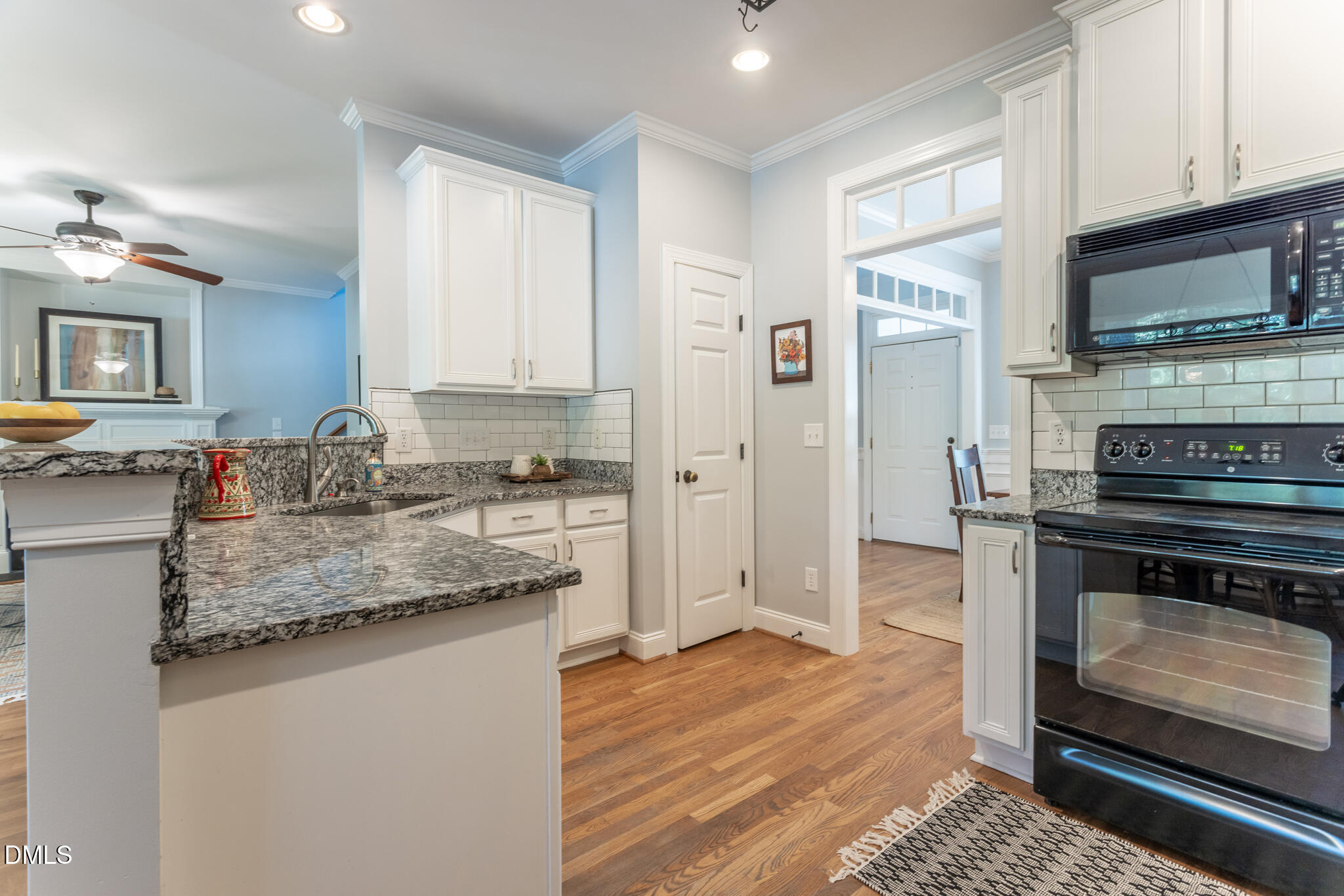 10 Highgrove Lane Durham, NC 27713 - Photo 11 of 41 a kitchen with stainless steel appliances granite countertop a stove a sink and a microwave