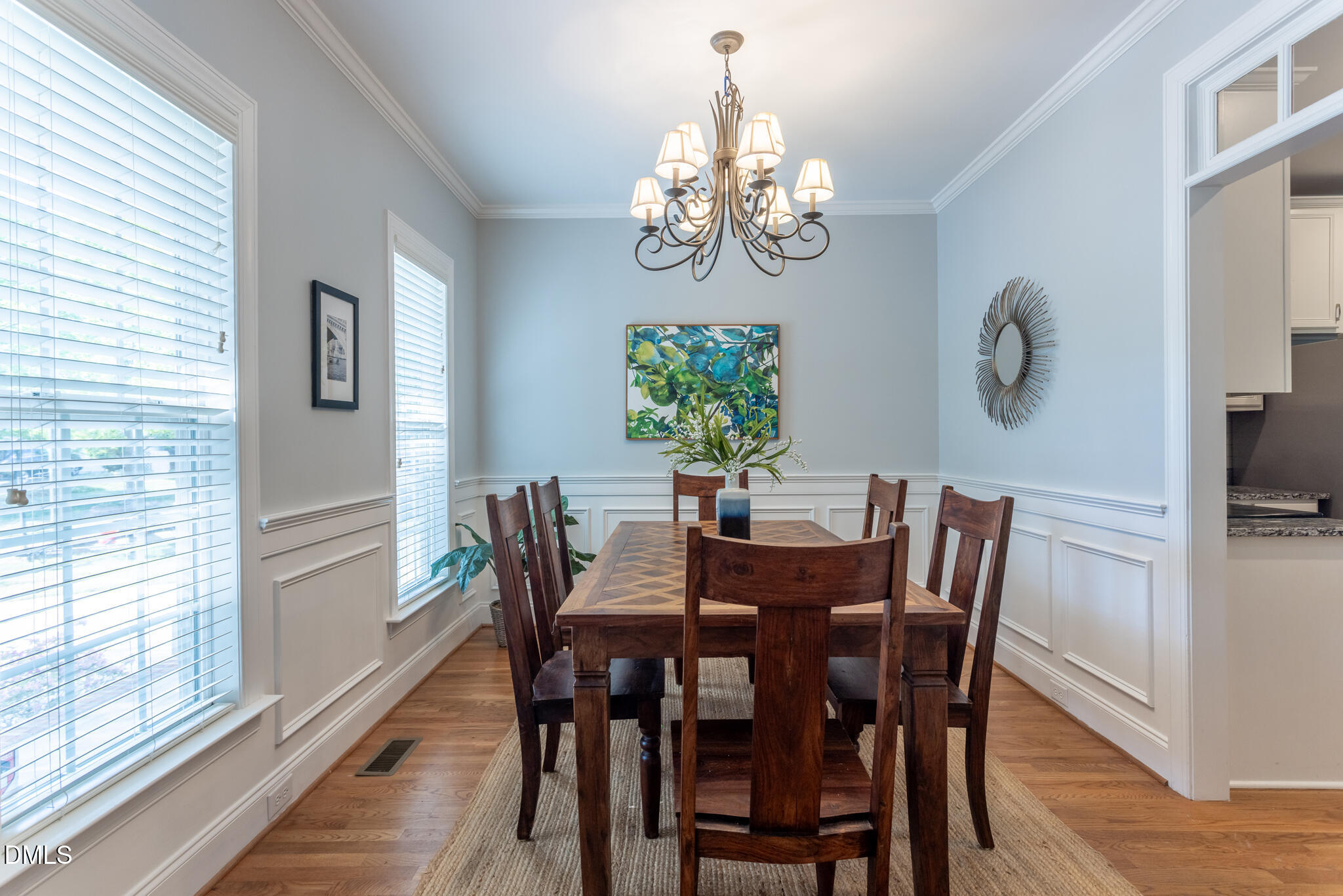 10 Highgrove Lane Durham, NC 27713 - Photo 14 of 41 a view of a dining room with furniture a chandelier and wooden floor