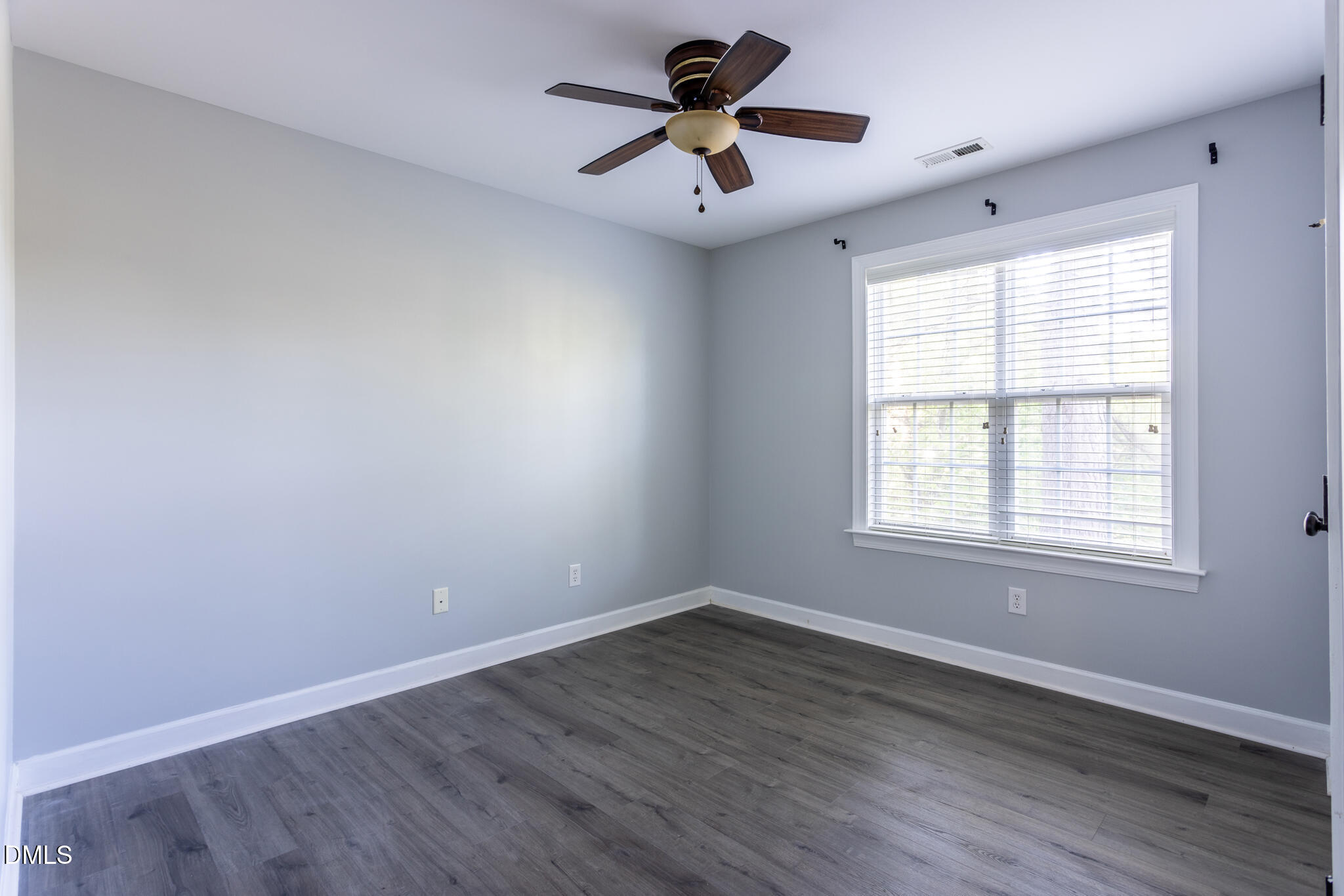 10 Highgrove Lane Durham, NC 27713 - Photo 27 of 41 an empty room with wooden floor and windows