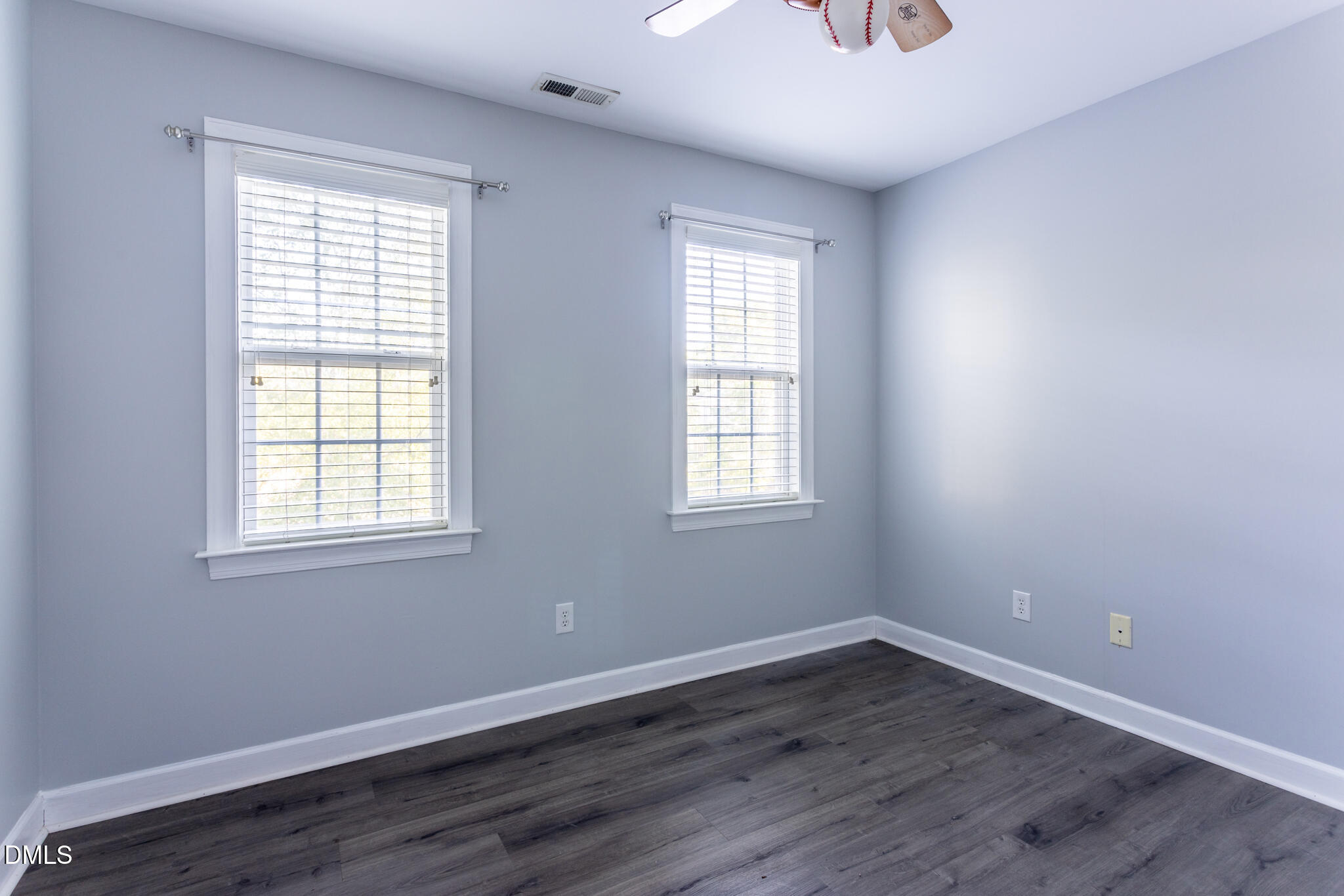 10 Highgrove Lane Durham, NC 27713 - Photo 28 of 41 an empty room with wooden floor and windows