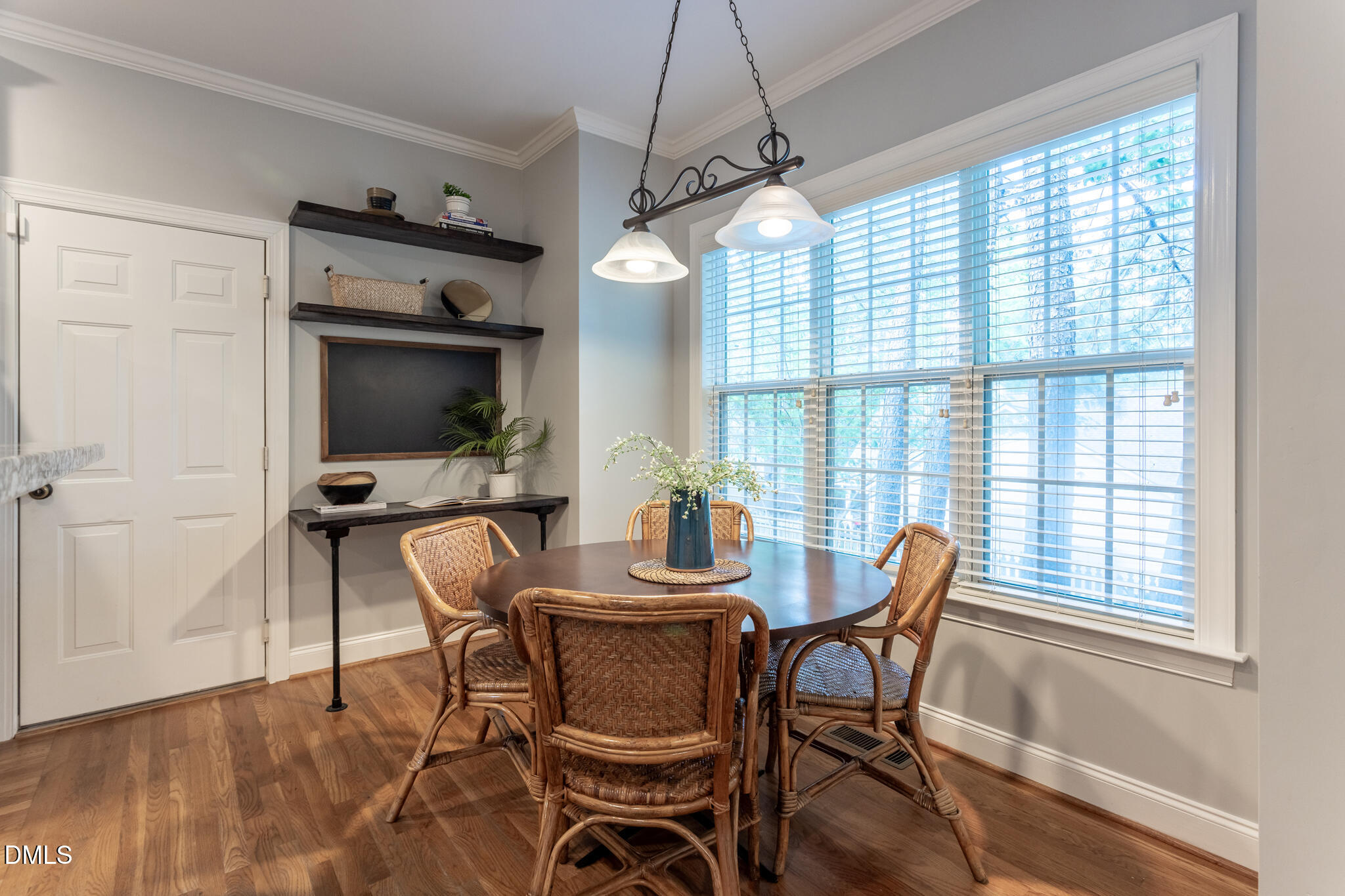 10 Highgrove Lane Durham, NC 27713 - Photo 8 of 41 a dining room with furniture a chandelier and wooden floor