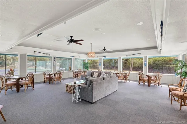 a kitchen with granite countertop cabinets a sink and stainless steel appliances