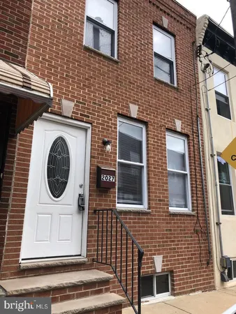 a front view of a house with a door