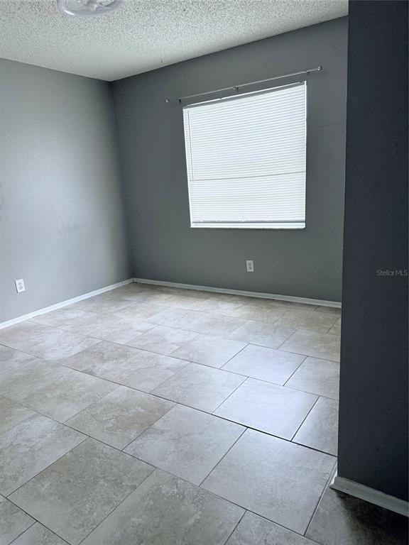 1636 Baker Road Lutz, FL 33559 - Photo 9 of 13 a view of an empty room with a window