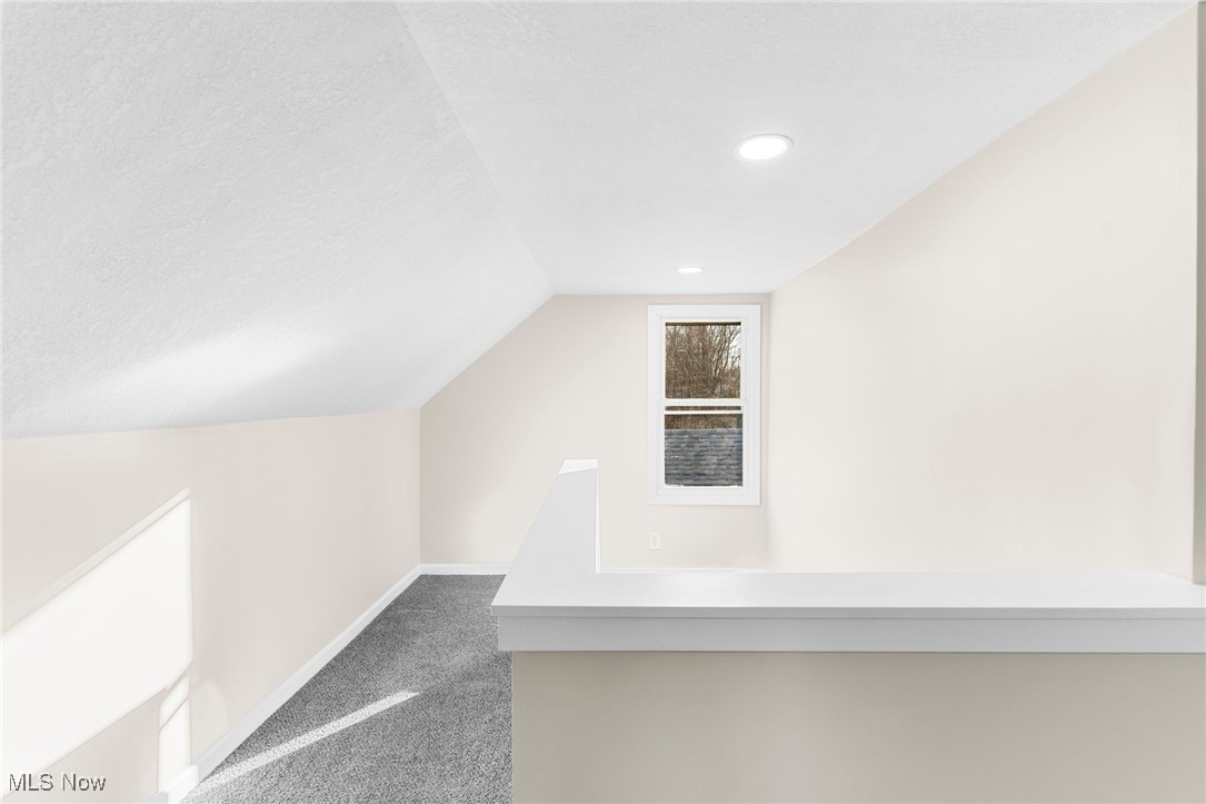 3441 Bell Wick Road Hubbard, OH 44425 - Photo 11 of 22 Additional living space featuring a textured ceiling, carpet, and vaulted ceiling