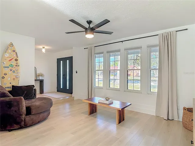 a living room with furniture and a large window