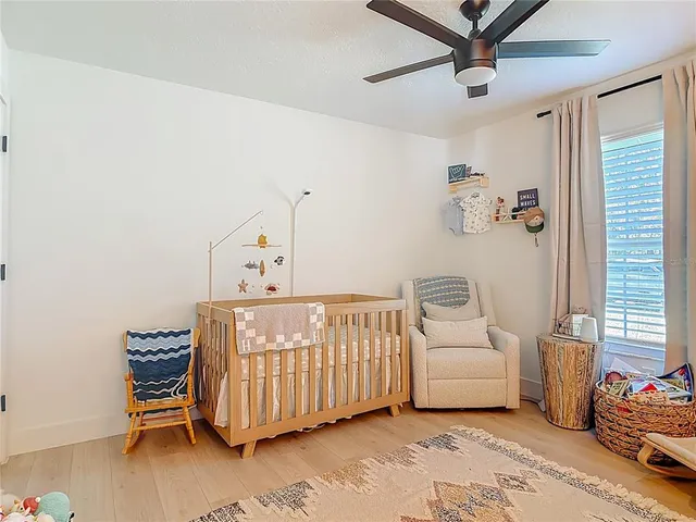 a bedroom with a bed and a couch