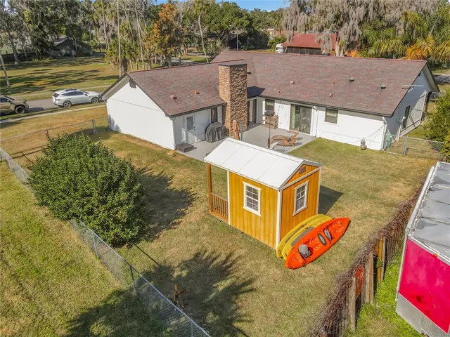 a view of a house with pool and ocean view