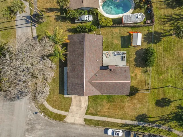 a aerial view of a house with a yard