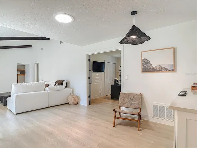 a living room with furniture and a window