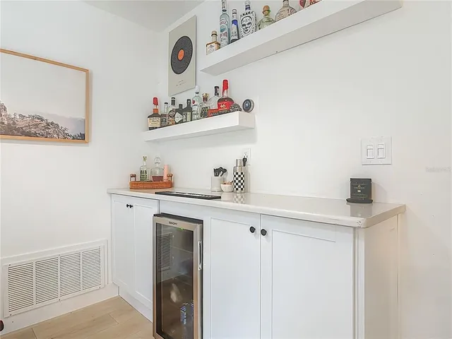 a kitchen with a sink a cabinets and appliances