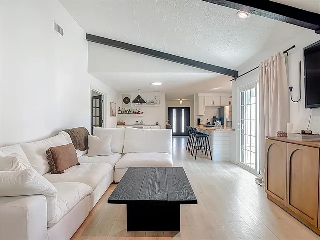 a living room with furniture and a table