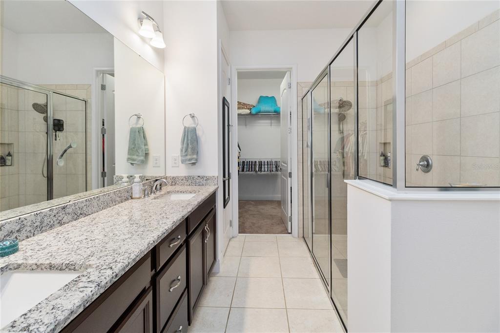 2557 Yellow Brick Road St. Cloud, FL 34772 - Photo 21 of 41 a bathroom with a granite countertop sink and a mirror