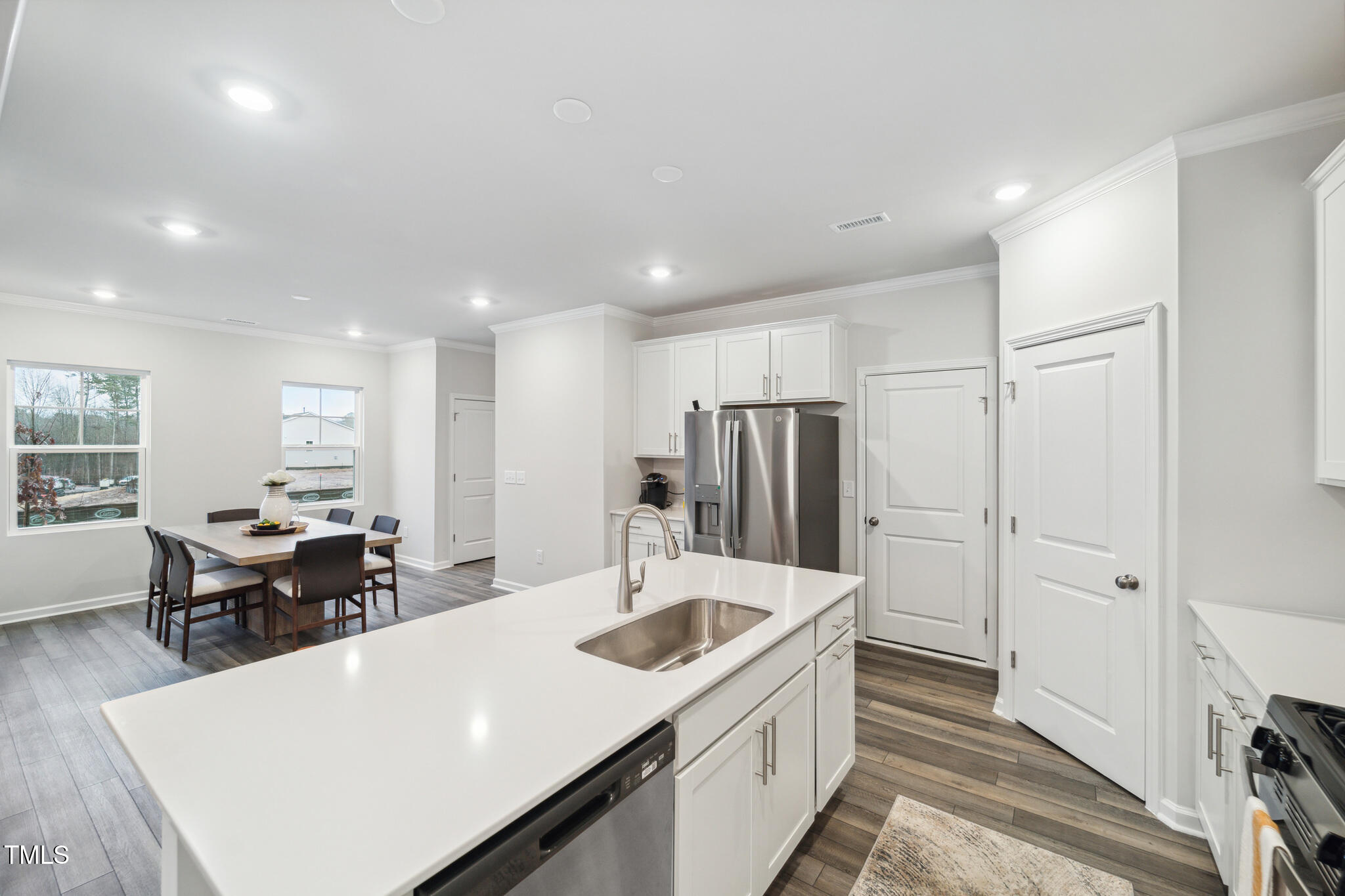 720 Maple Br Circle Graham, NC 27253 - Photo 11 of 40 a large white kitchen with a large window