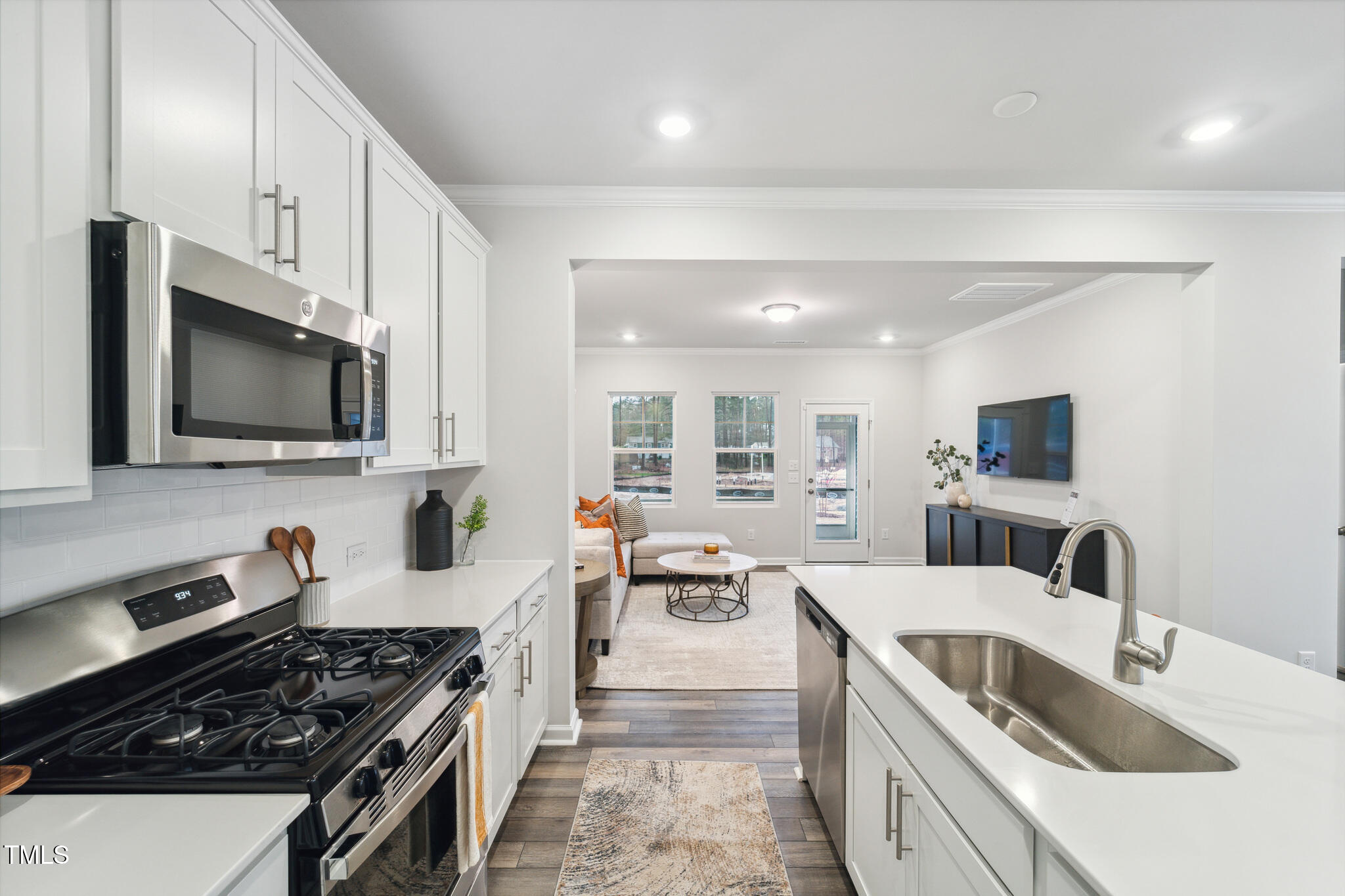 720 Maple Br Circle Graham, NC 27253 - Photo 22 of 40 a kitchen with stainless steel appliances a stove a sink a microwave and cabinets