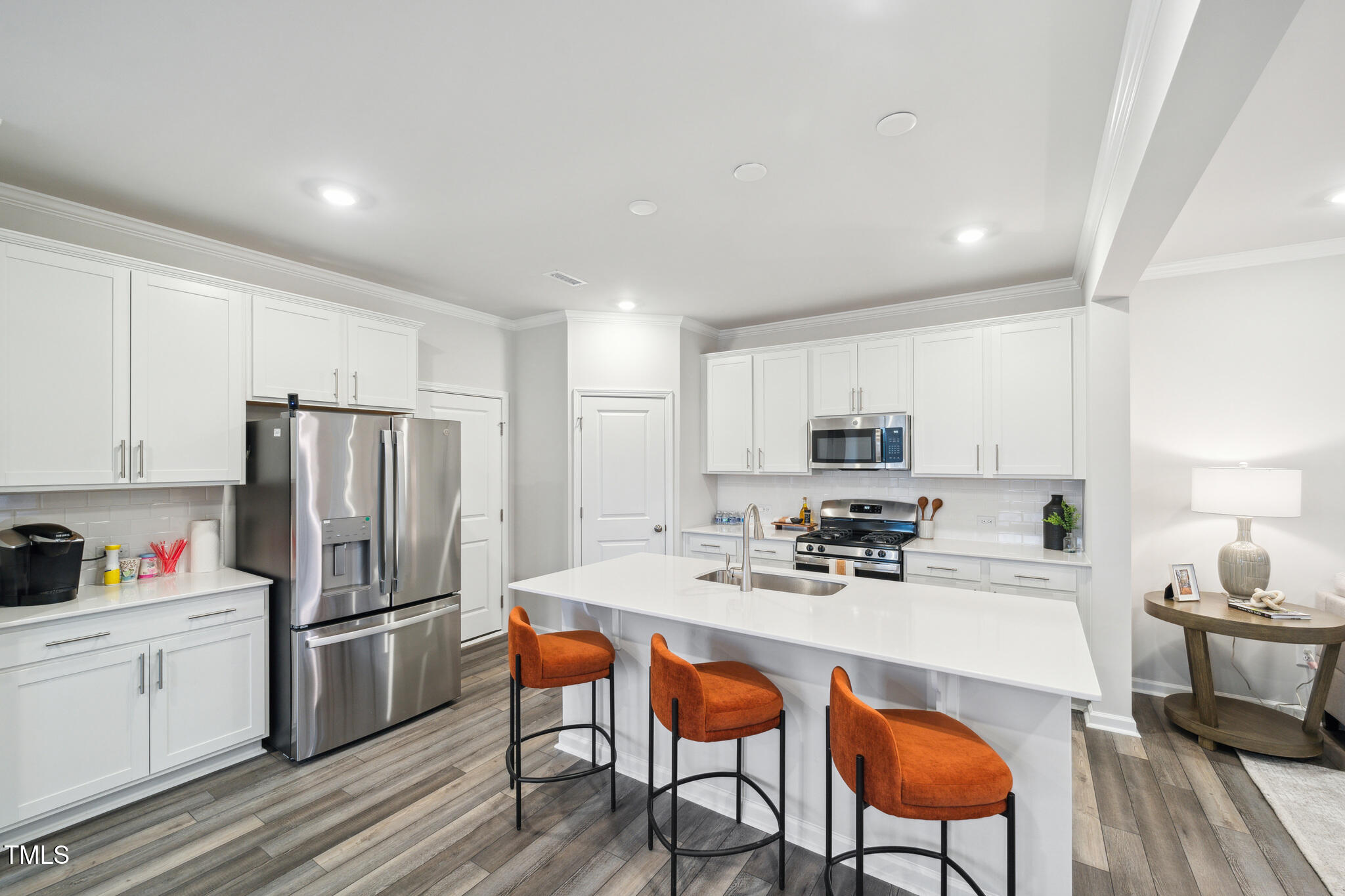 720 Maple Br Circle Graham, NC 27253 - Photo 5 of 40 a kitchen with stainless steel appliances a refrigerator and a table