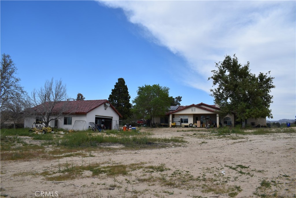 19485 Kinai Road Apple Valley, CA 92307 - Photo 2 of 12 a front view of a house with a yard