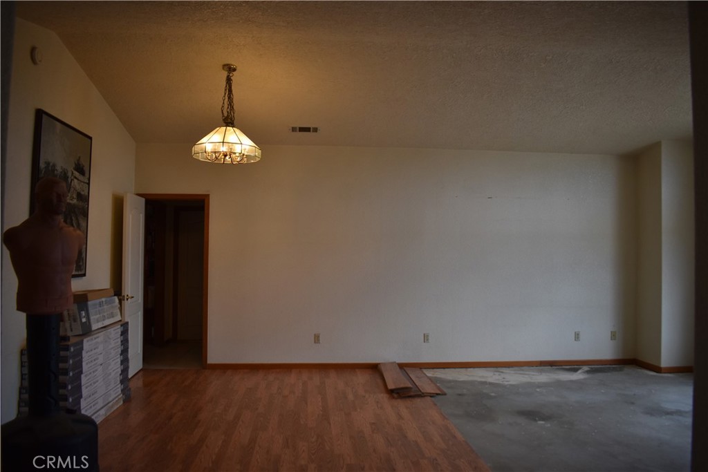 19485 Kinai Road Apple Valley, CA 92307 - Photo 4 of 12 a view of an empty room with a fireplace