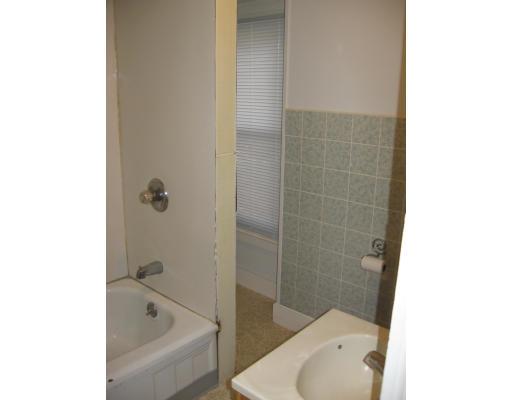 45 Hope Street Springfield, MA 01119 - Photo 7 of 10 a bathroom with a bathtub and toilet