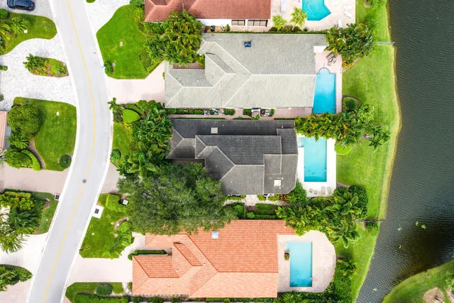 aerial view of a house with a yard and garden