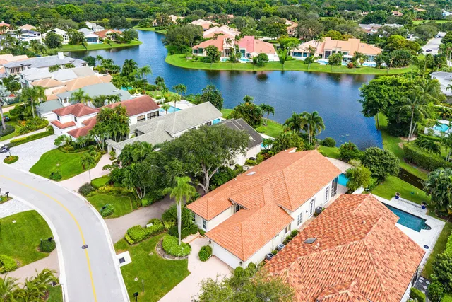 an aerial view of a house with a lake view