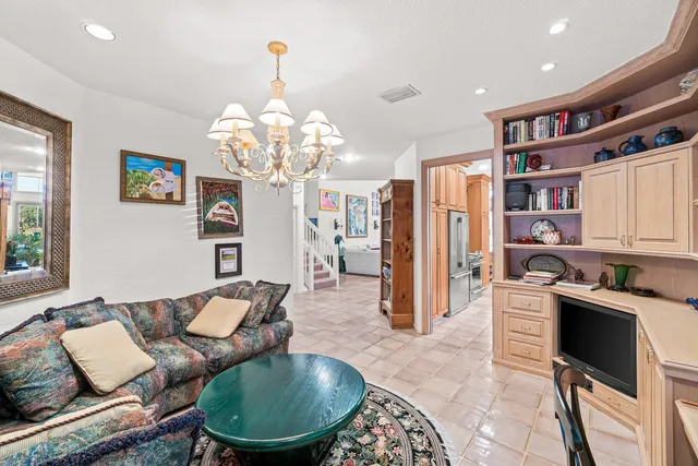 a view of a garden with plants and large trees
