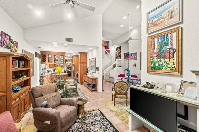 a front view of a house with a yard and a garden