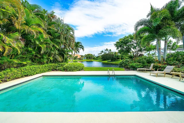 a view of swimming pool with a yard