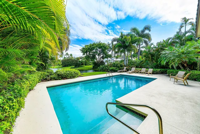 a view of a swimming pool with a patio