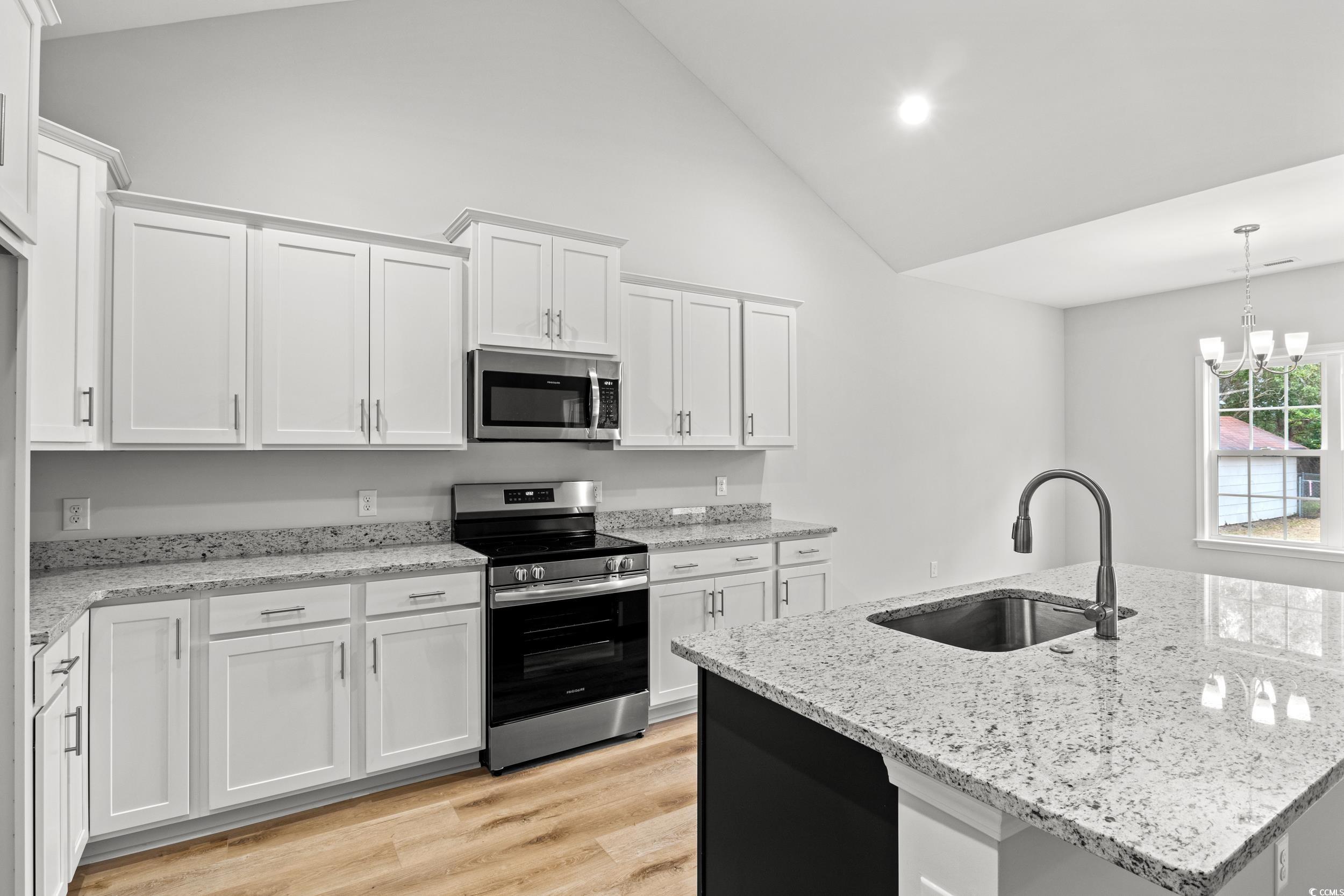 608 Britt Street Georgetown, SC 29440 - Photo 6 of 34 Kitchen featuring a kitchen island with sink, whit