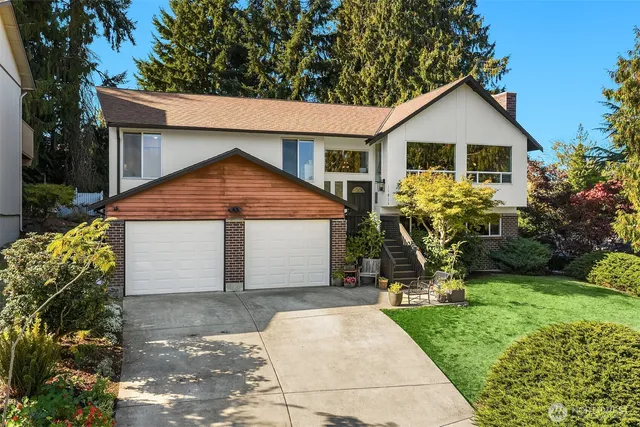 a front view of house with a garden