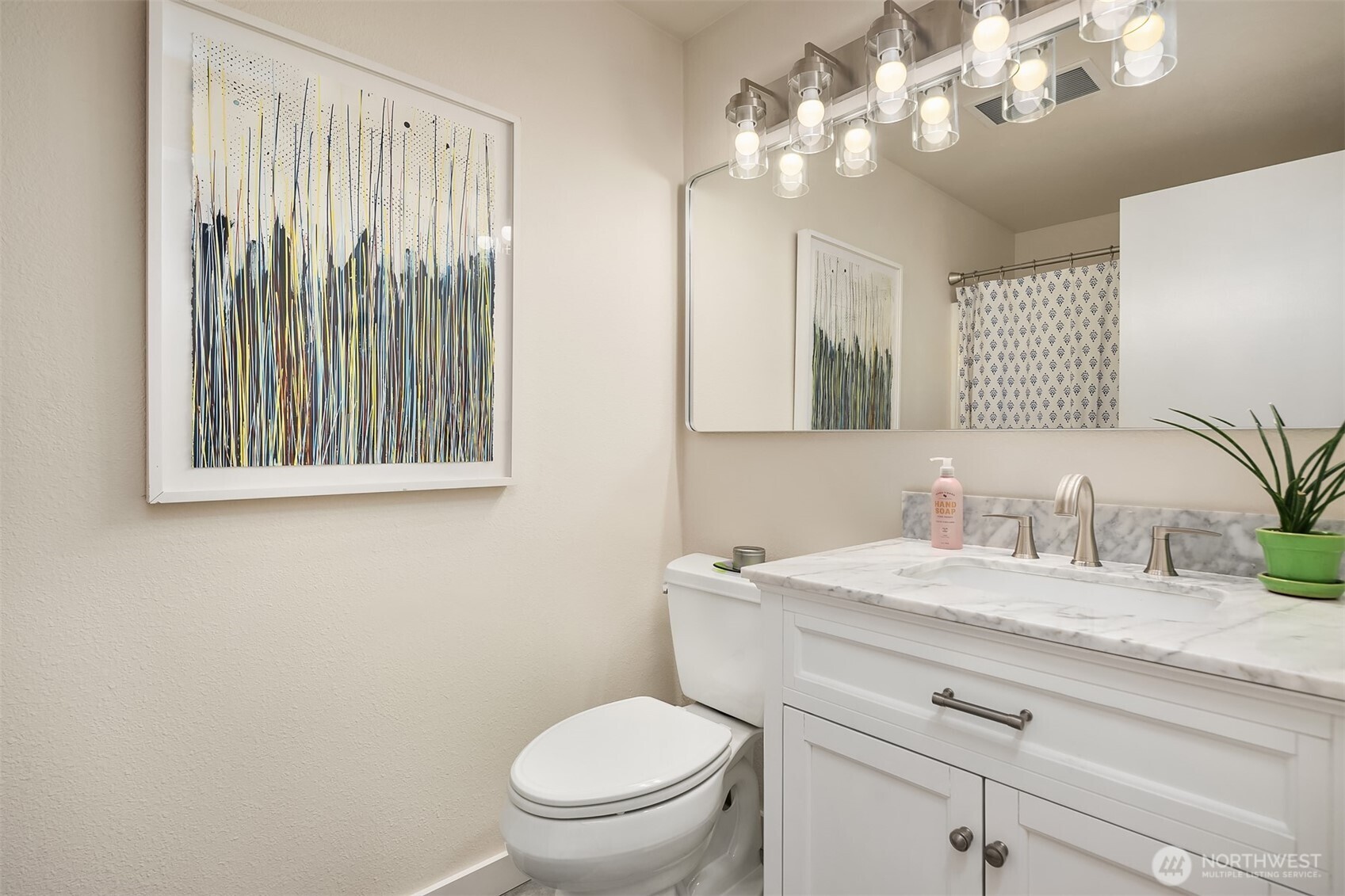 11813 79th Avenue South Seattle, WA 98178 - Photo 13 of 27 a bathroom with a toilet a sink and mirror