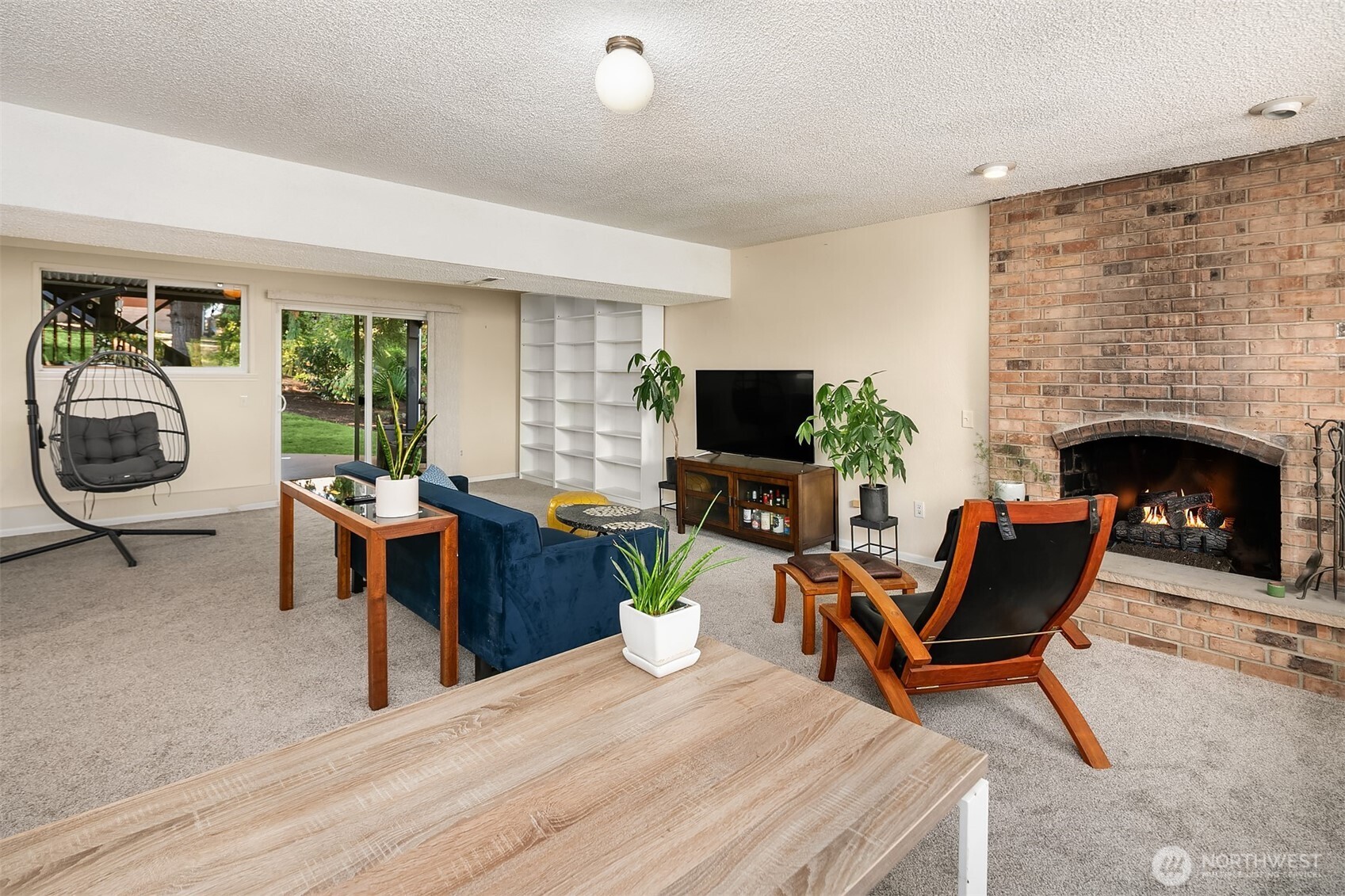 11813 79th Avenue South Seattle, WA 98178 - Photo 16 of 27 a living room with furniture a fireplace and a flat screen tv