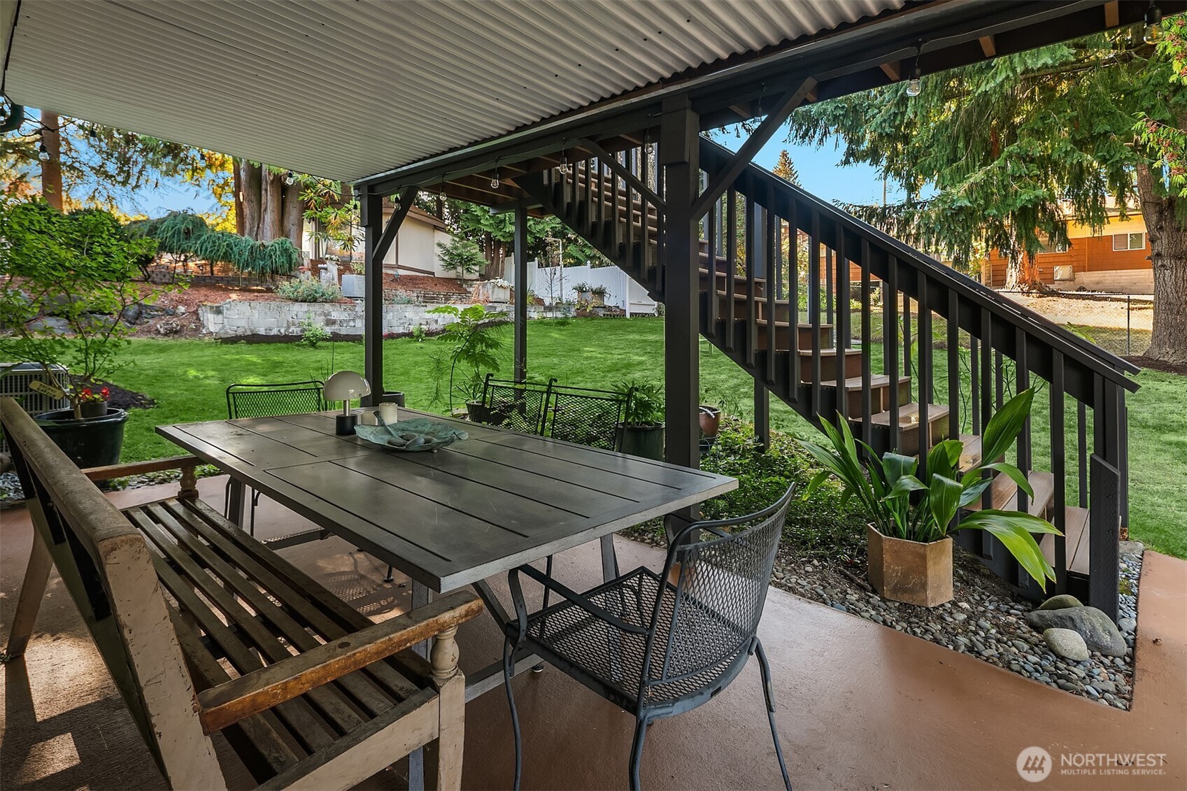 11813 79th Avenue South Seattle, WA 98178 - Photo 21 of 27 a view of a patio with a table chairs and a backyard