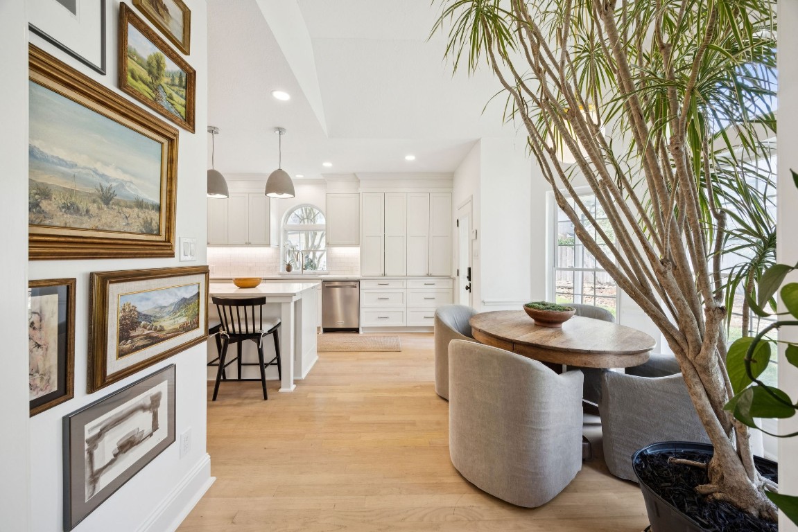 2 North Thundercreek Place Spring, TX 77381 - Photo 15 of 47 The kitchen adjoins with a bright and airy breakfast nook - the true heart of this home!