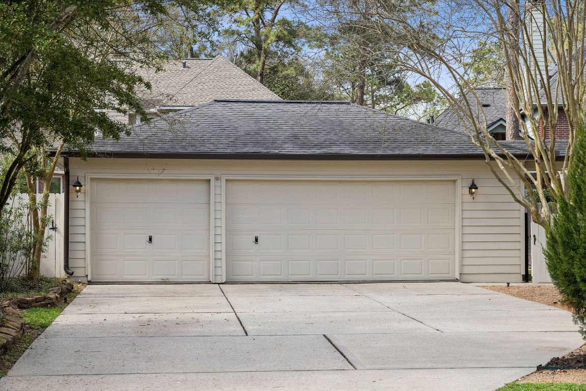 2 North Thundercreek Place Spring, TX 77381 - Photo 45 of 47 A rare 3-car garage offers amazing storage space!