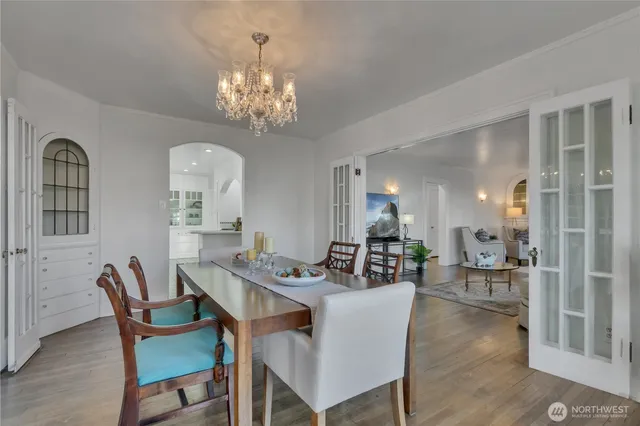 a view of a dining room with furniture and chandelier