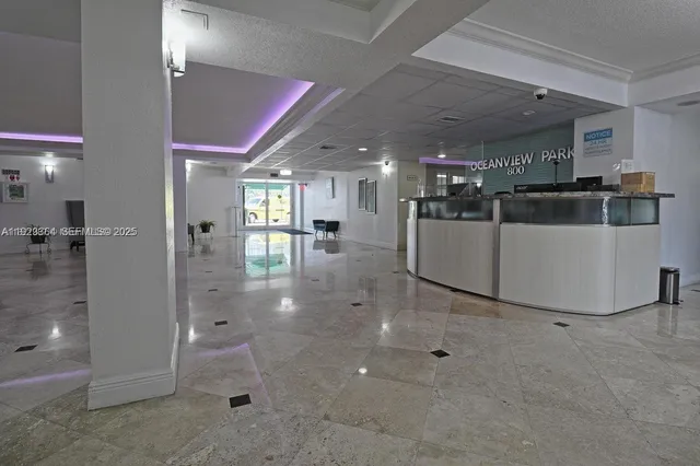 a kitchen with stainless steel appliances a refrigerator and a counter top space