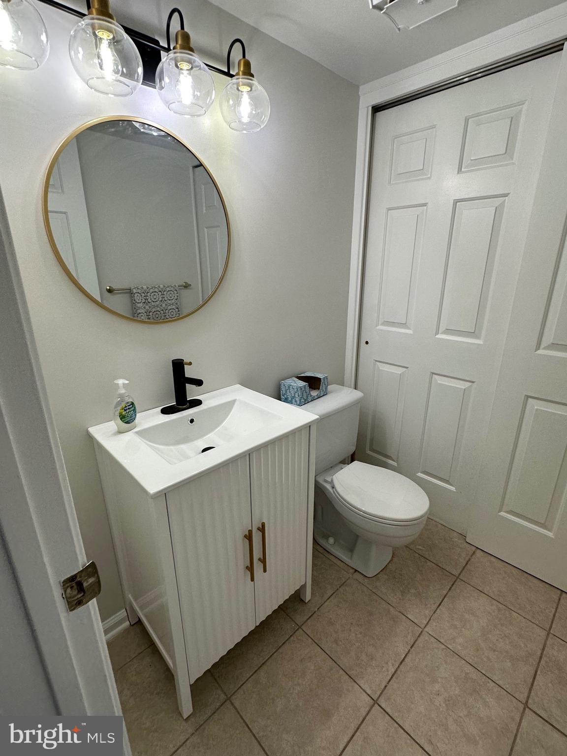 692 Danbury Court Newtown, PA 18940 - Photo 4 of 16 a bathroom with a sink mirror and toilet