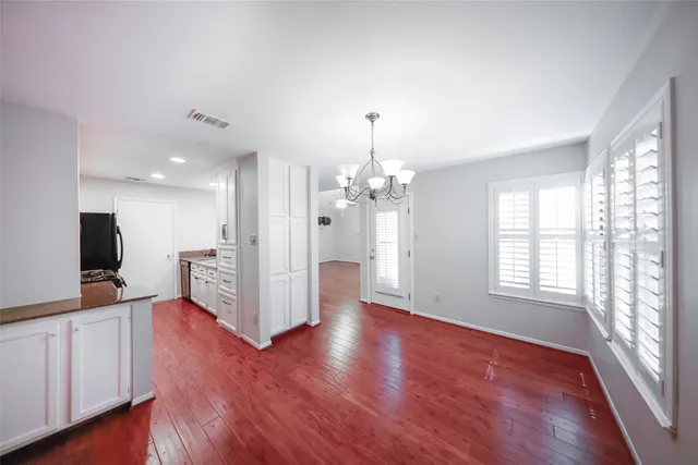 a bathroom with a sink mirror vanity and toilet