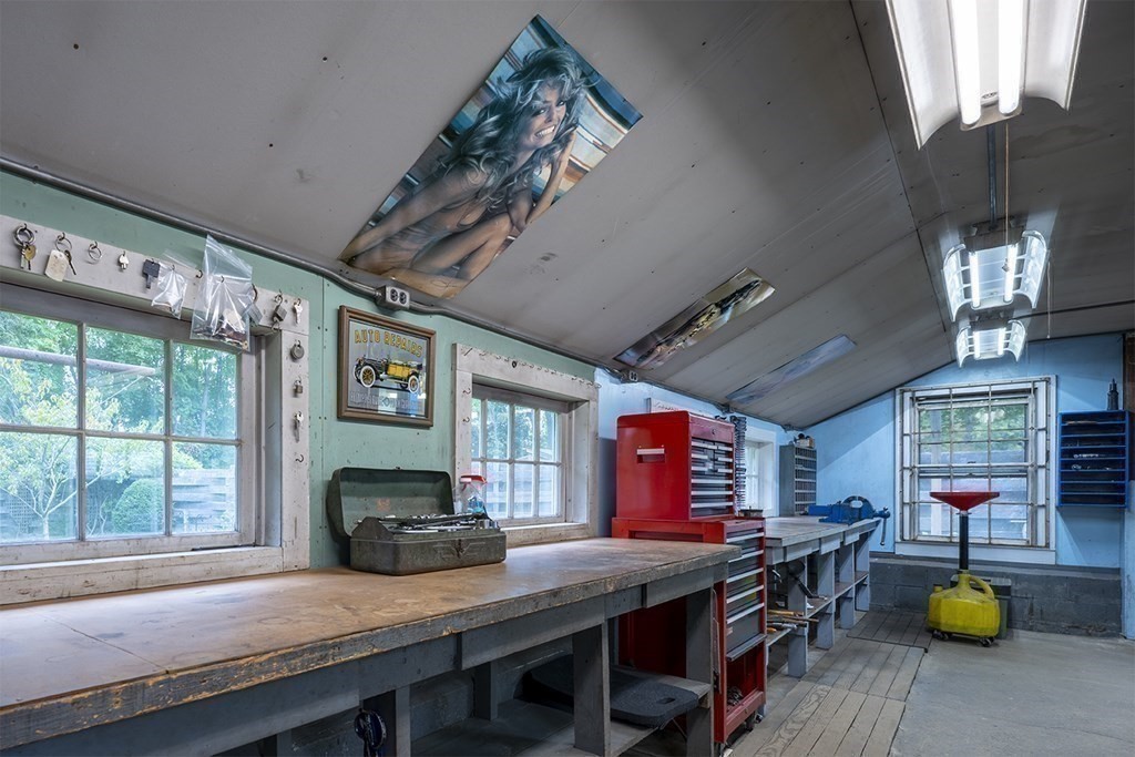 23 Salem Road Billerica, MA 01862 - Photo 33 of 42 a kitchen with a wooden table and chairs