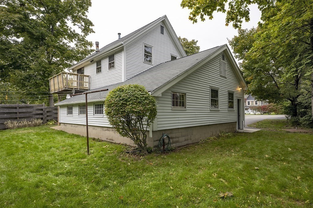23 Salem Road Billerica, MA 01862 - Photo 35 of 42 a view of a house with a yard plants and large tree