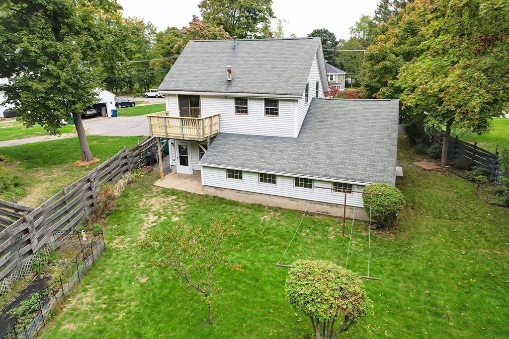 23 Salem Road Billerica, MA 01862 - Photo 37 of 42 a aerial view of a house with a yard table and chairs