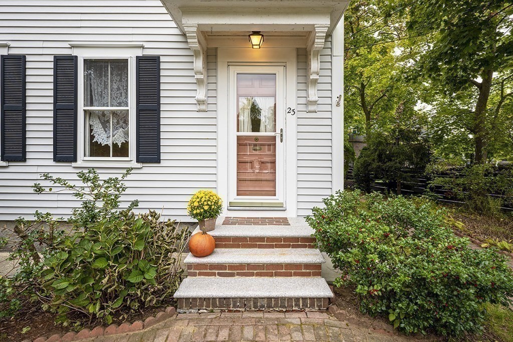 23 Salem Road Billerica, MA 01862 - Photo 5 of 42 a view of a house with potted plants and a fountain