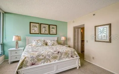 a bathroom with double vanity sink and a mirror