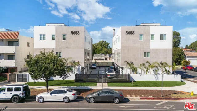 a view of a parked cars in front of a building