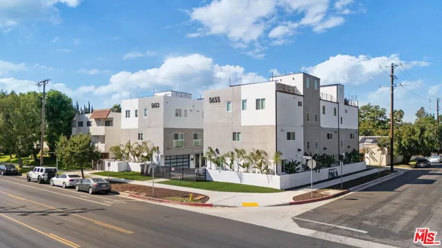 a view of a city street lined with tall buildings